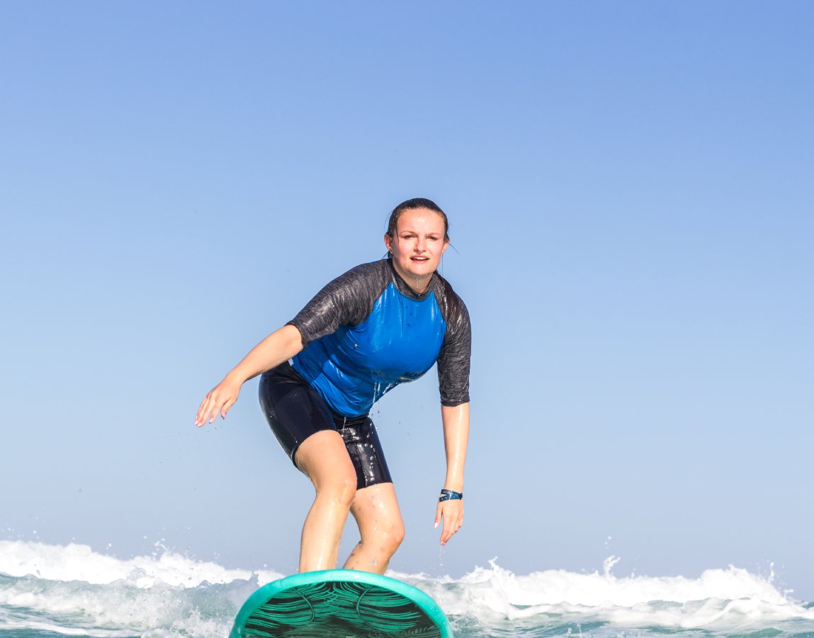 An image of a surfer girl