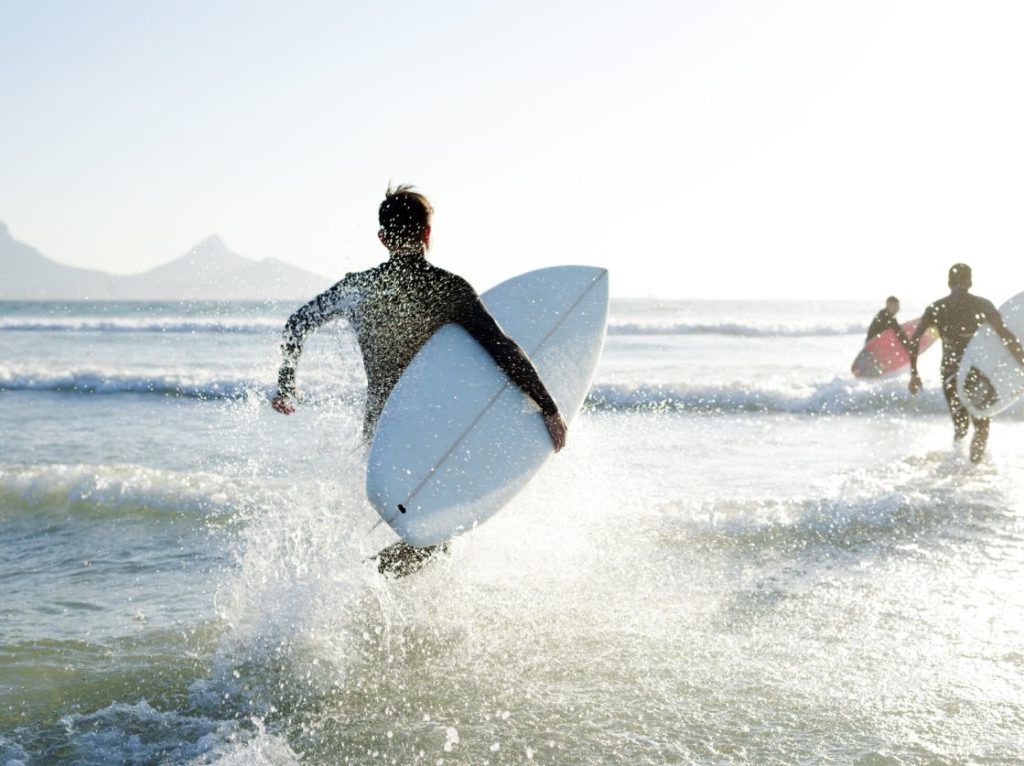 An image of surfing people