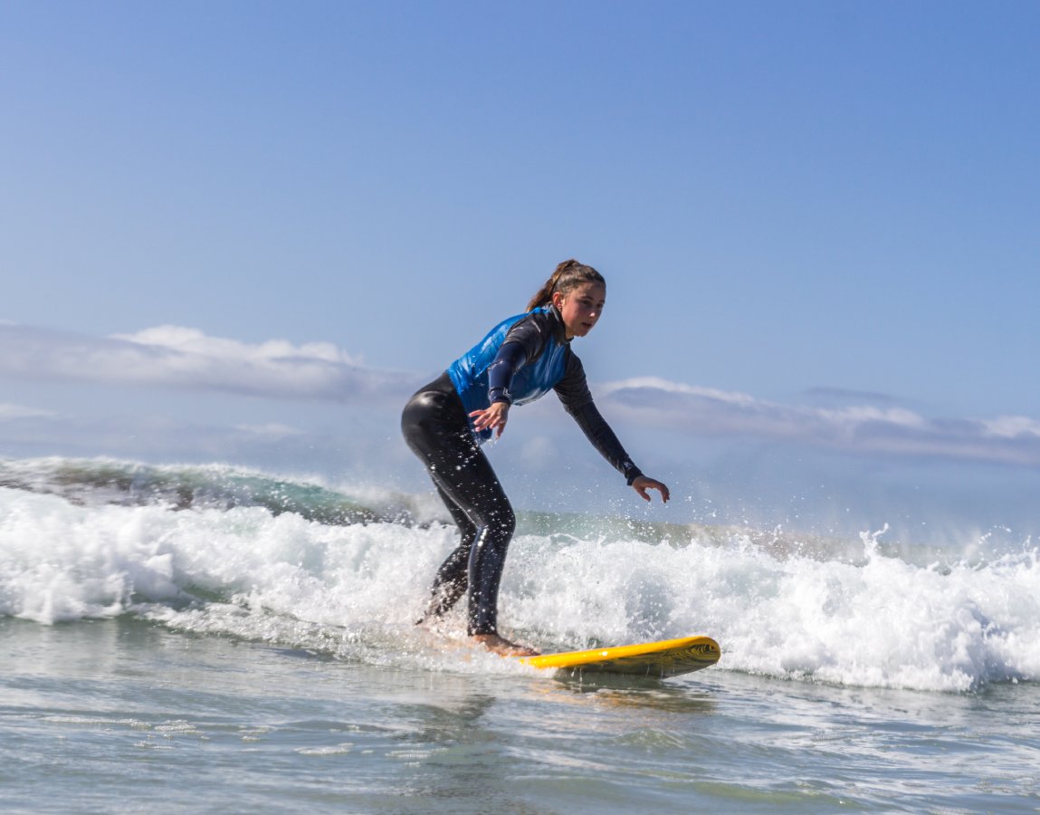 An image of a surfer girl